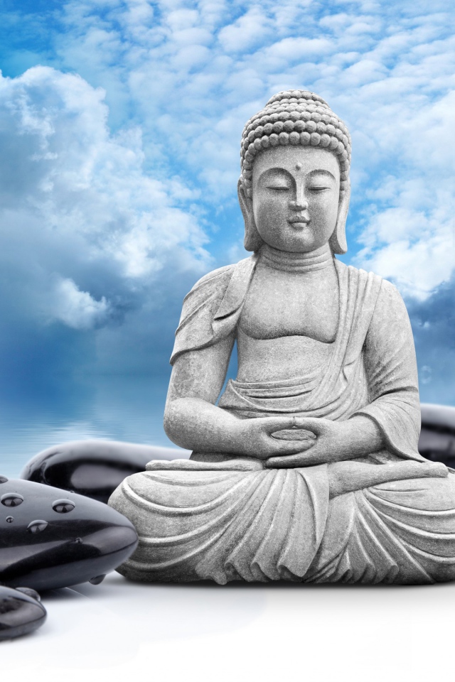 Buddha on a background of black stone