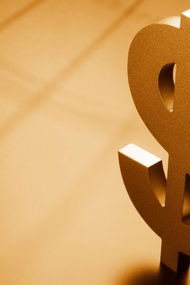 Металлический знак доллара