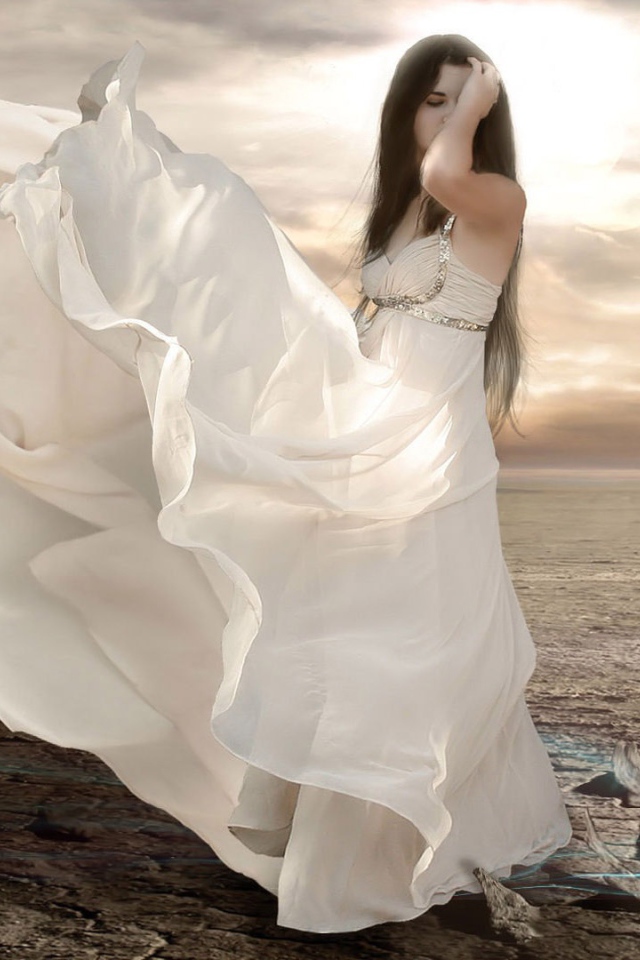 Girl in a white dress in the desert