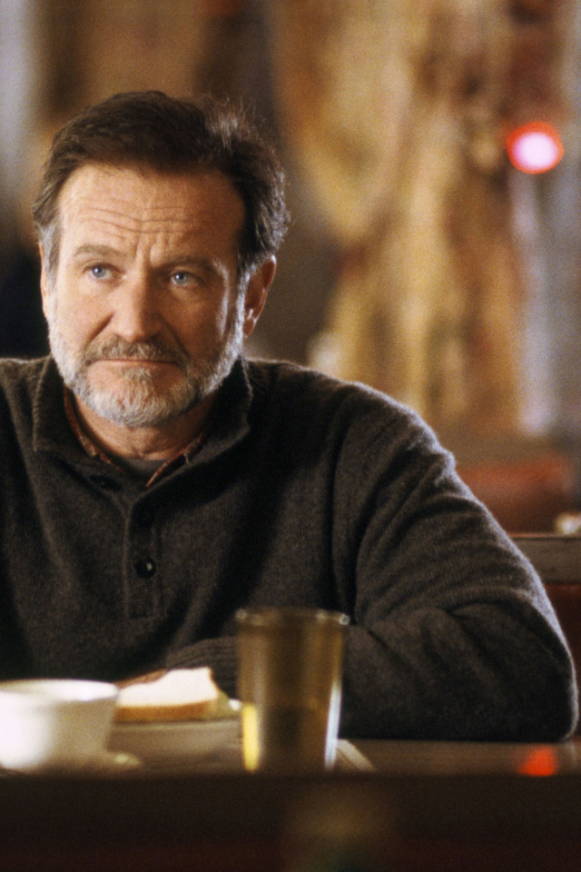 Актер Робин Уильямс за столом