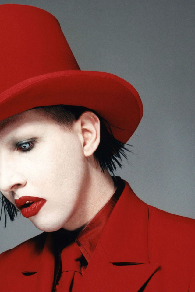 Marilyn Manson in a red hat