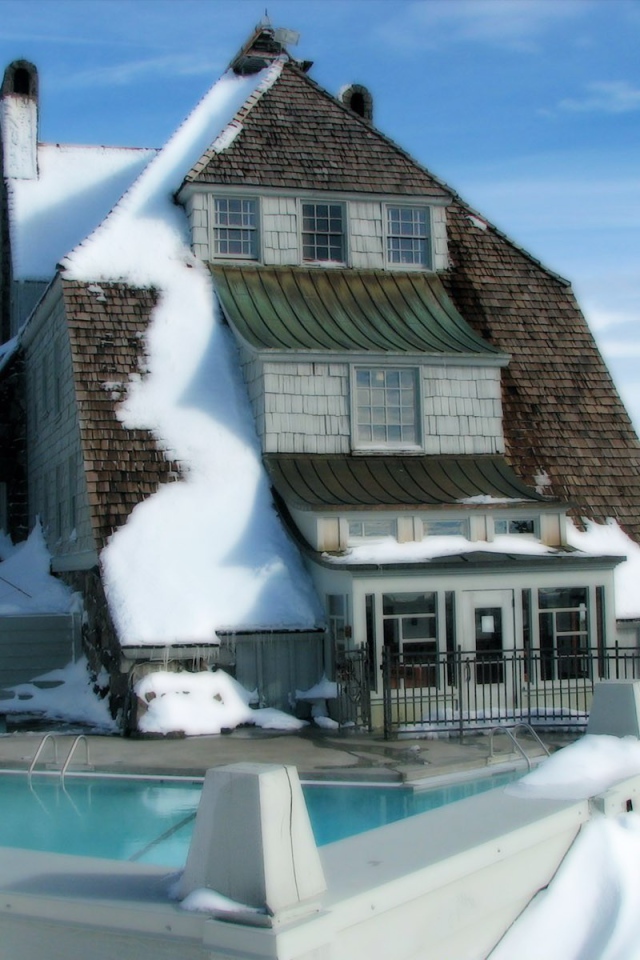 	   Snow-covered house with swimming pool