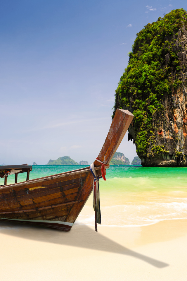 Boat on the background of rocks at the resort in Krabi, Thailand