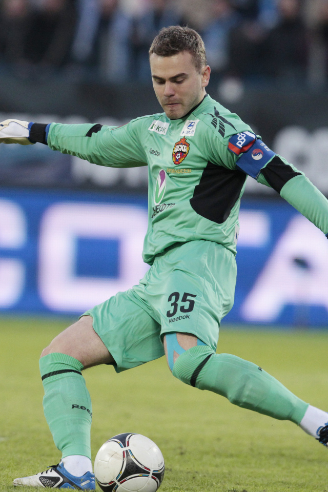 CSKA goalkeeper Igor Akinfeev hits the ball