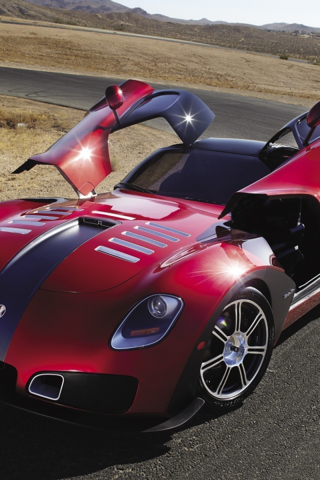 Красный автомобиль Devon GTX на повороте