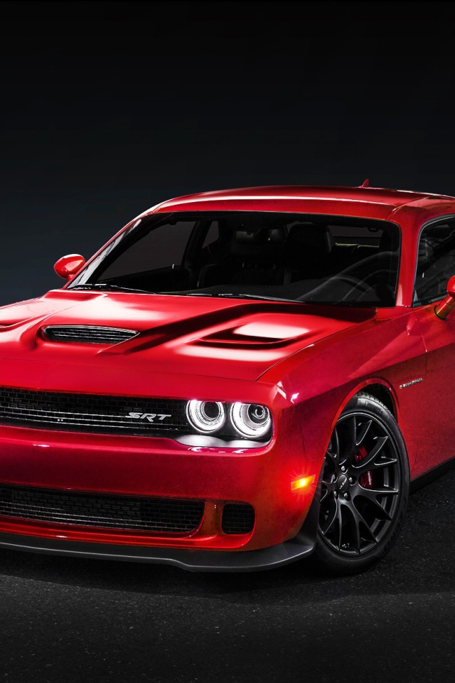 Red Dodge Challenger Hellcat on a black background