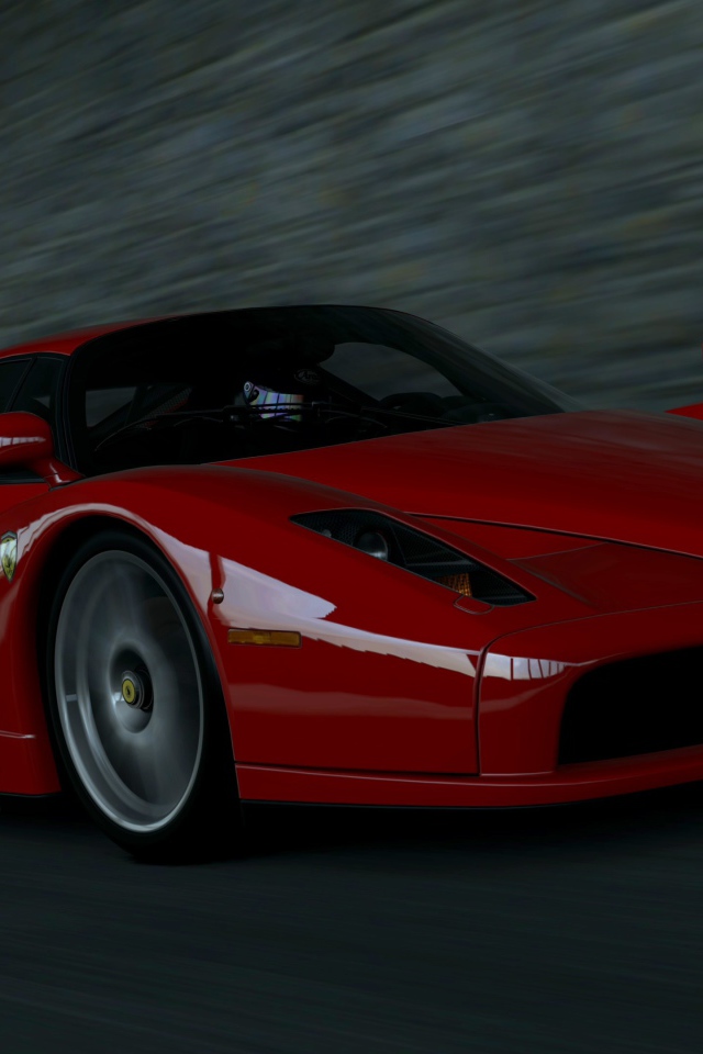 Красный Ferrari Enzo мчится на черном фоне