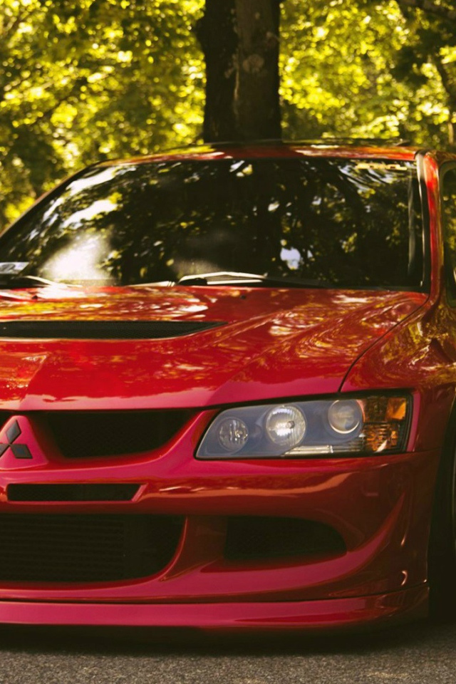 Красный Mitsubishi Lancer Evolution IX