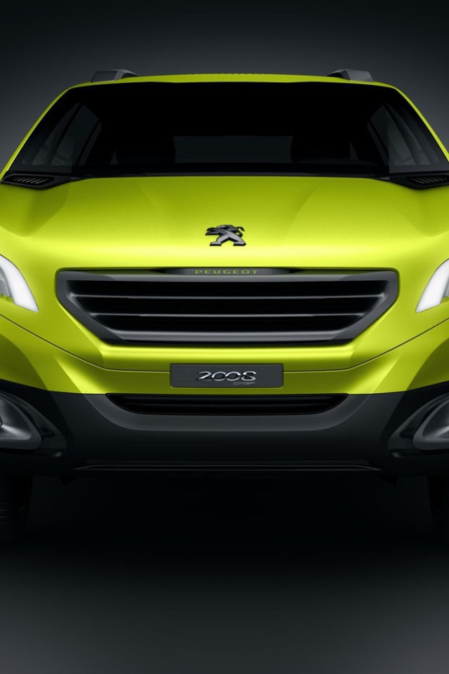 Желтый Peugeot 2008 на сером фоне