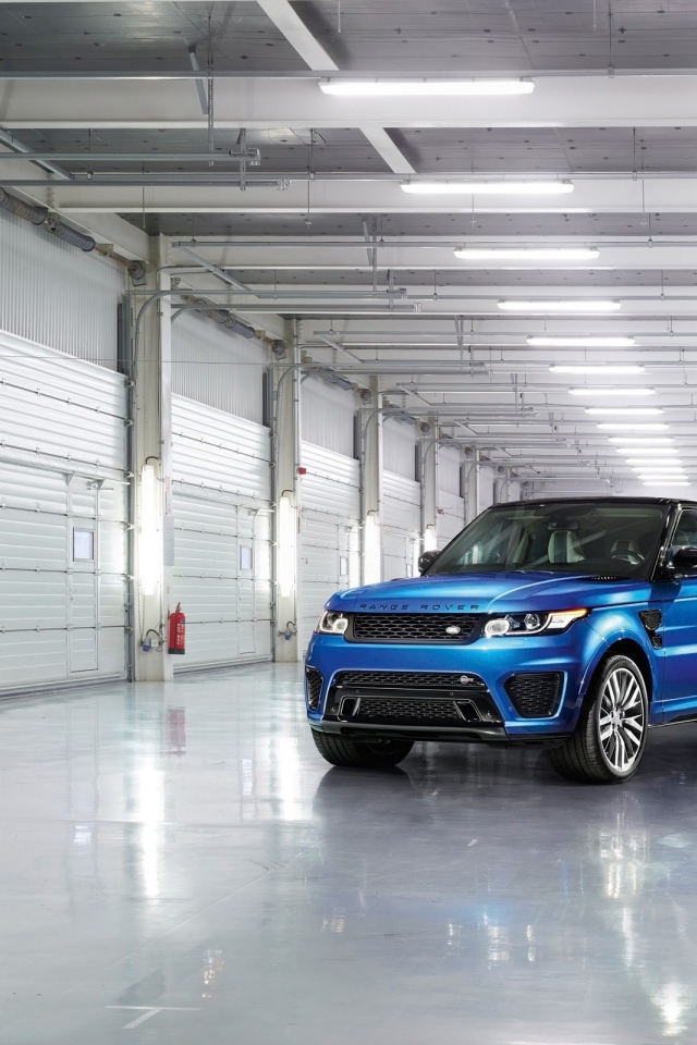 Blue Range Rover in the garage