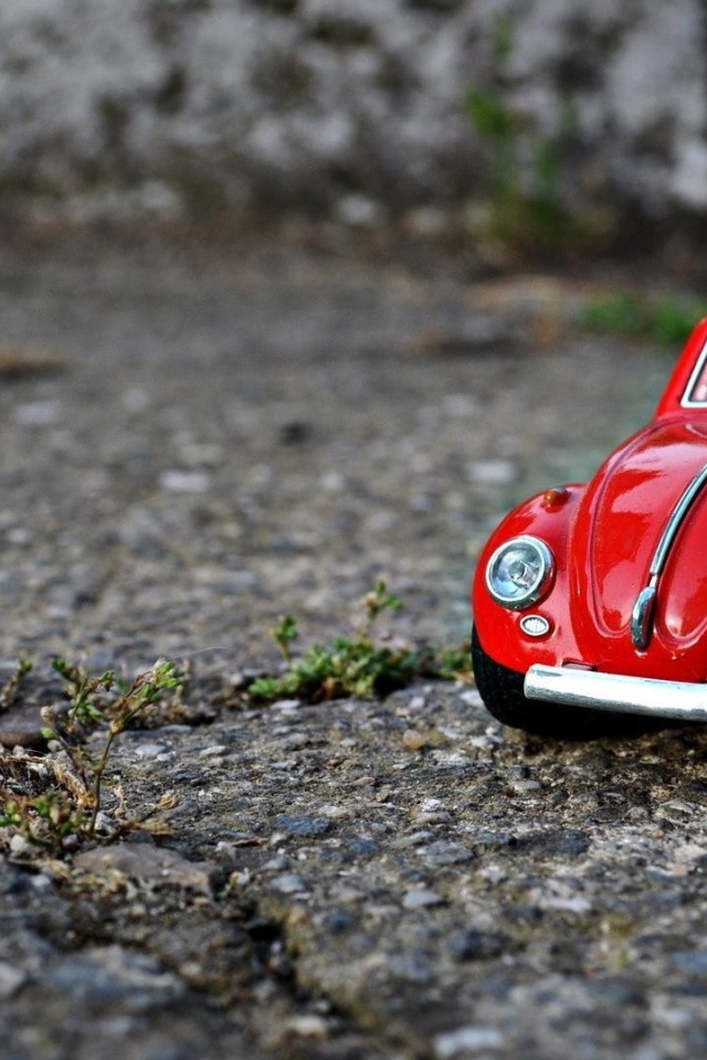 Модель красного автомобиля Volkswagen Beetle