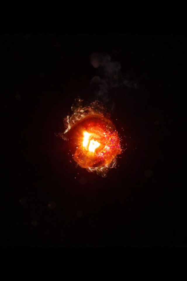 Горящий уголек, черный фон