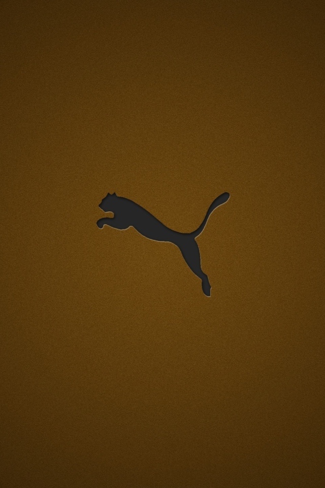 Логотип фирмы Пума на коричневом фоне