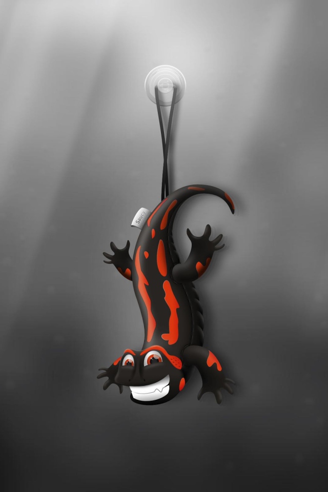 Ящерица игрушка, серый фон