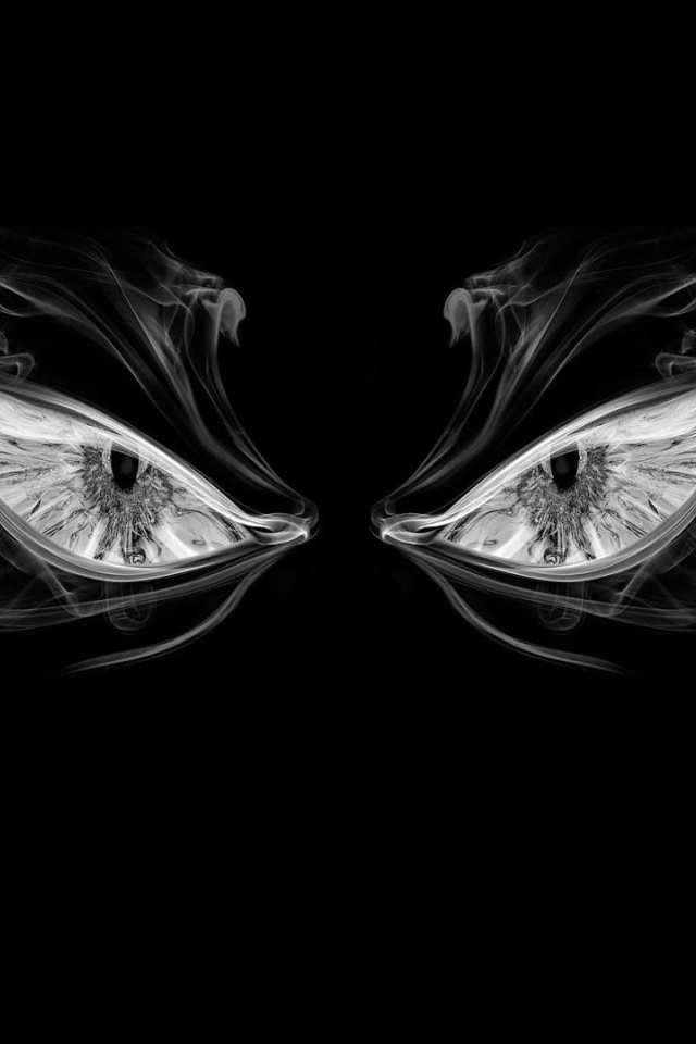 Глаза из дыма на черном фоне