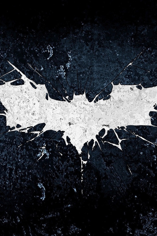 Белый символ летучей мыши на черном фоне