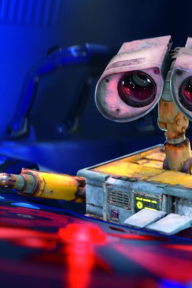 Робот WALL·E за пультом управления