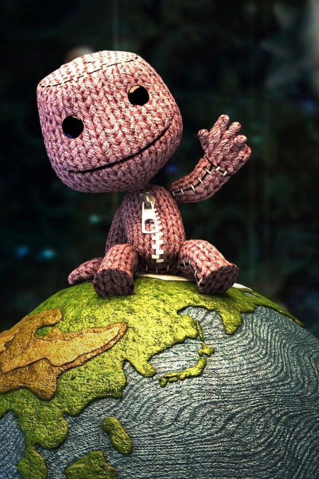 Вязаный человечек на глобусе