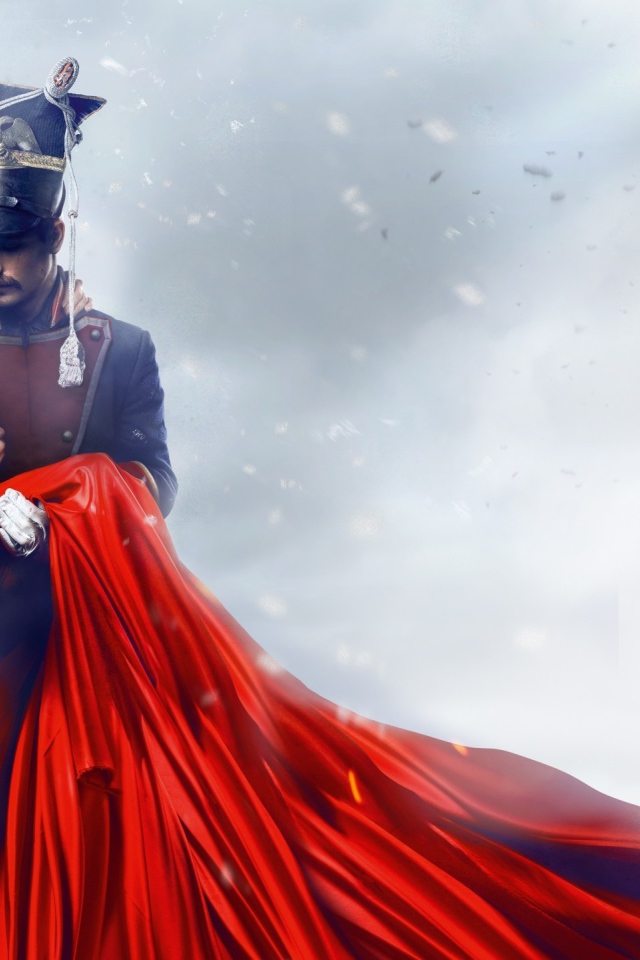 Улан держит на руках девушку в красном платье