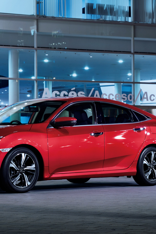 Стильный красный автомобиль Honda Civic в автосалоне