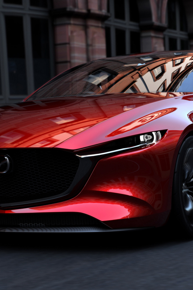 Красный автомобиль Mazda Kai на улицах города