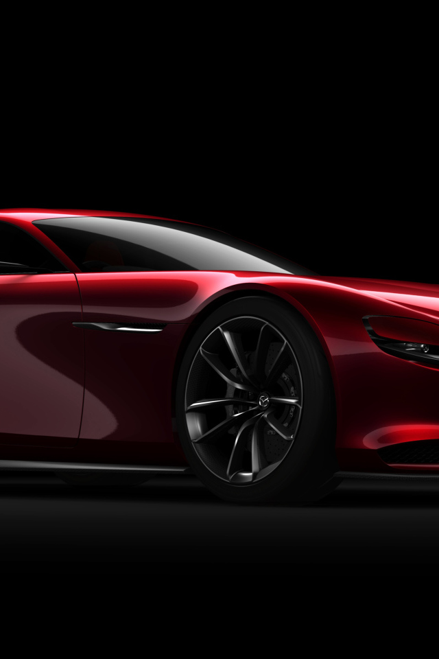 Красный спортивный автомобиль Mazda RX Vision Concept на черном фоне