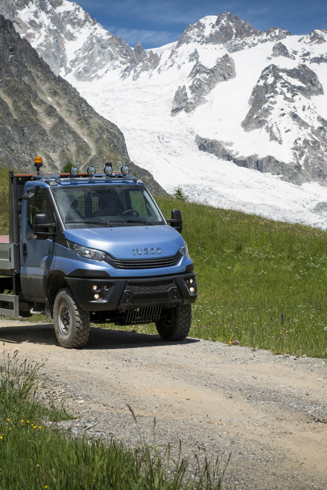 Blue IVECO Daily 55 4x4 Chassis Cab on the background of the mountains