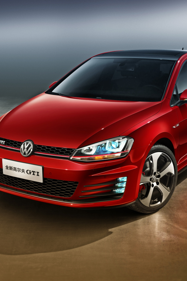 Автомобиль Volkswagen Golf GTI красного цвета 