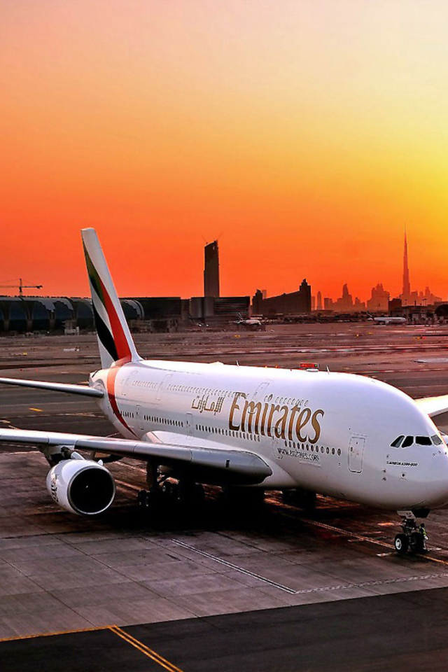 Airbus A380 Emirates airline on the sunset background