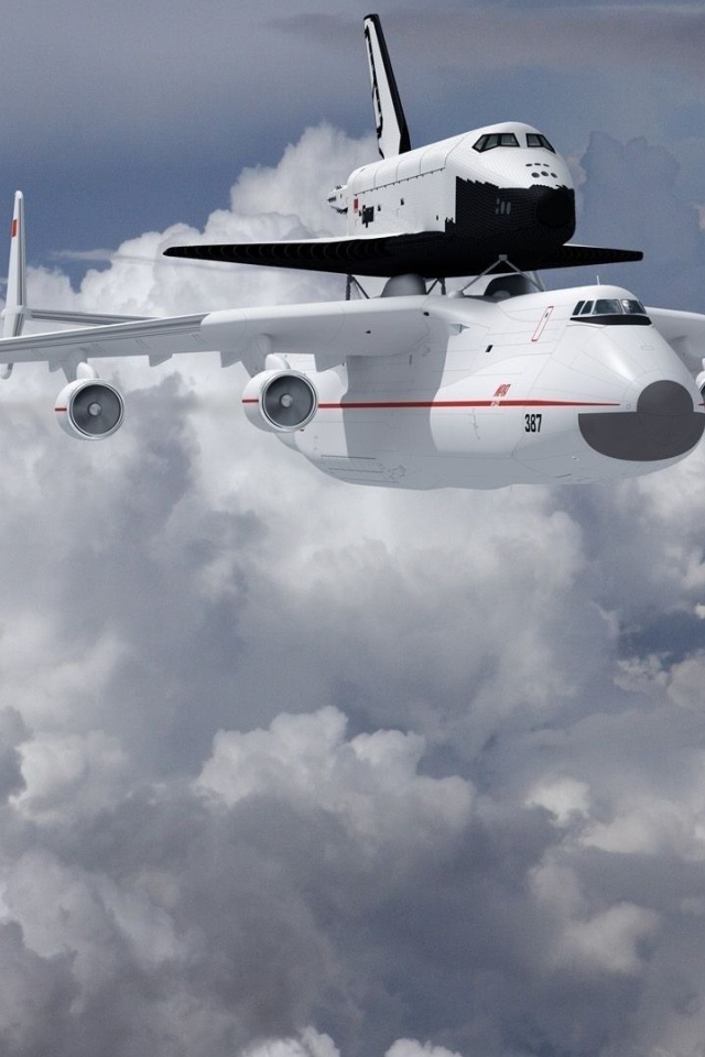 Самолет Ан- 225 Мрия  и ракета носитель «Буран» в на фоне белых облаков 