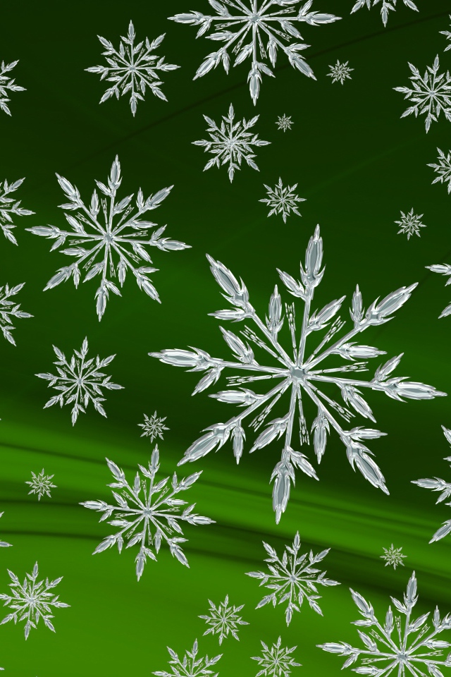 Кристальные белые снежинки на зеленом фоне