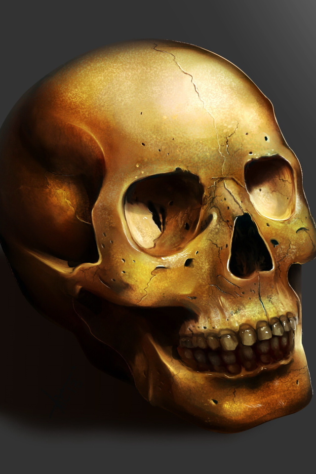Золотой череп на сером фоне