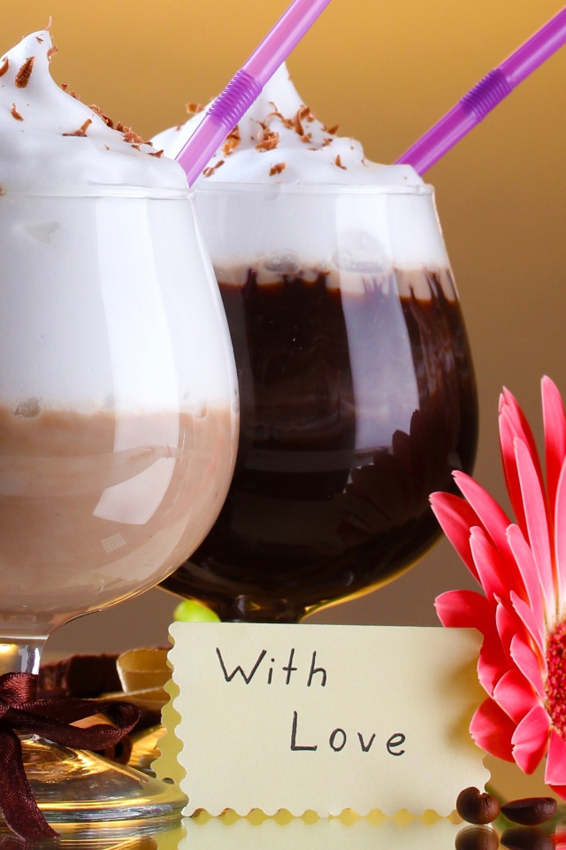 Два стакана с десертом, корицей и цветком герберы