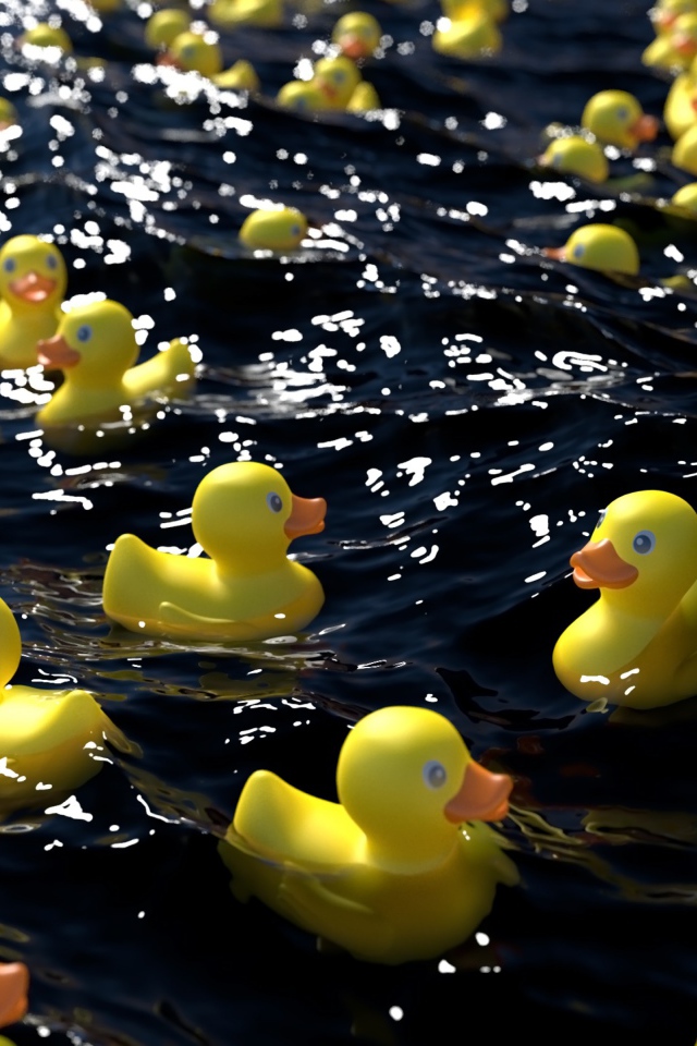 Много желтых резиновых уточек в воде