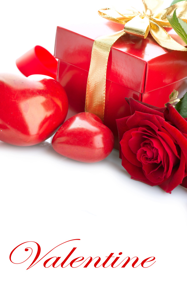 Красная роза с подарком и сердечками на белом фоне ко Дню всех влюбленных 14 февраля