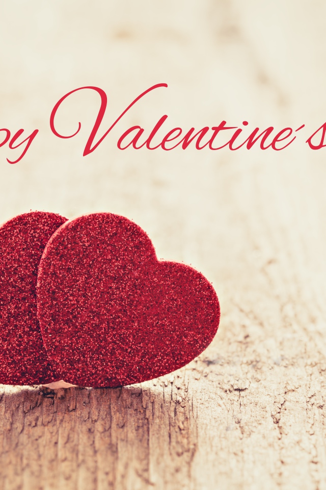 Два красных сердца на фоне надписи С Днем Святого Валентина