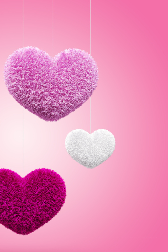 Мягкие пушистые сердечки на розовом фоне 