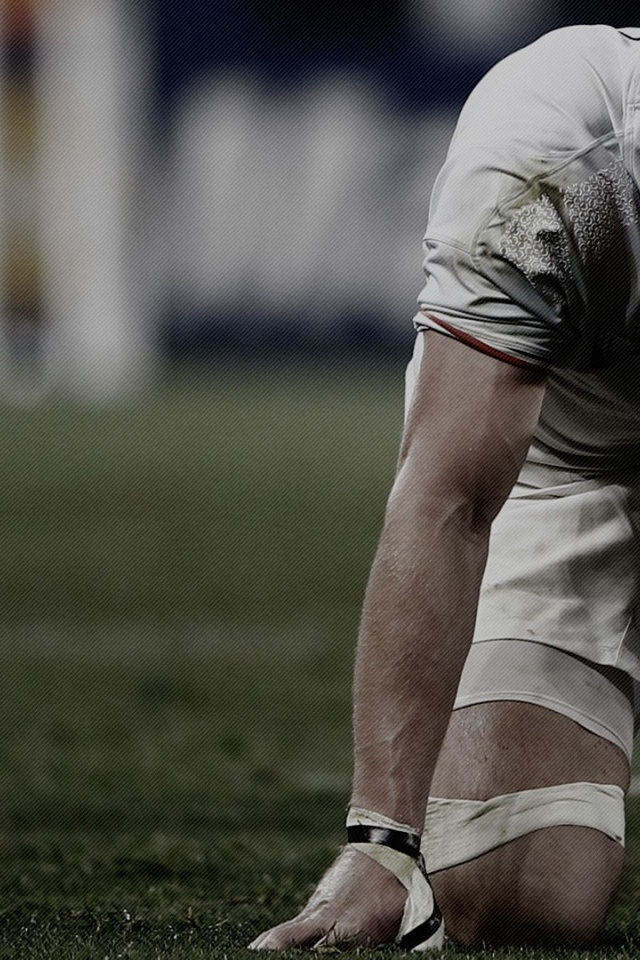 Спортсмен регбист на поле 