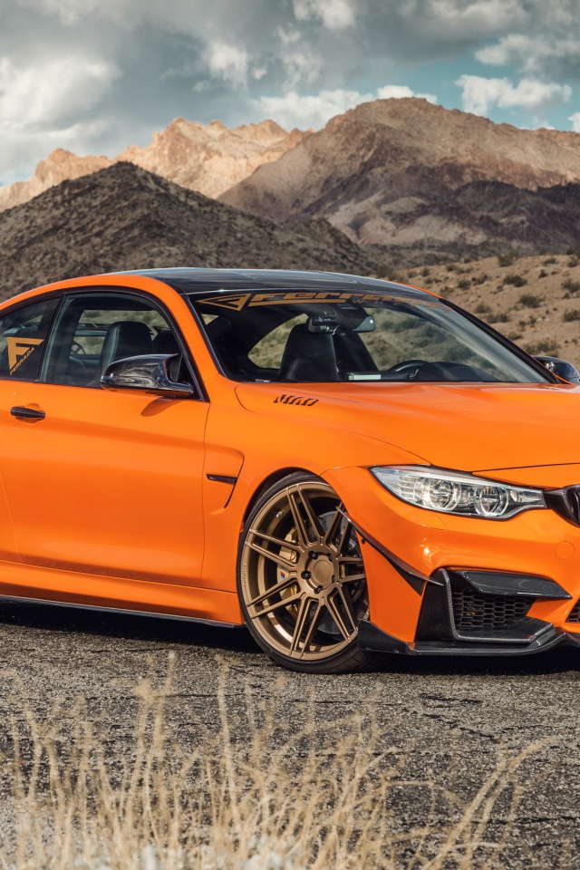 Новый автомобиль Ferrada Sema Orange BMW M4 на фоне гор