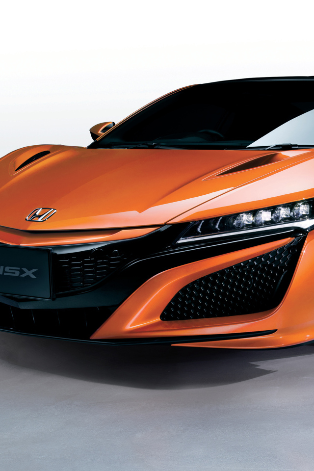 Оранжевый быстрый автомобиль Honda NSX 2018 года
