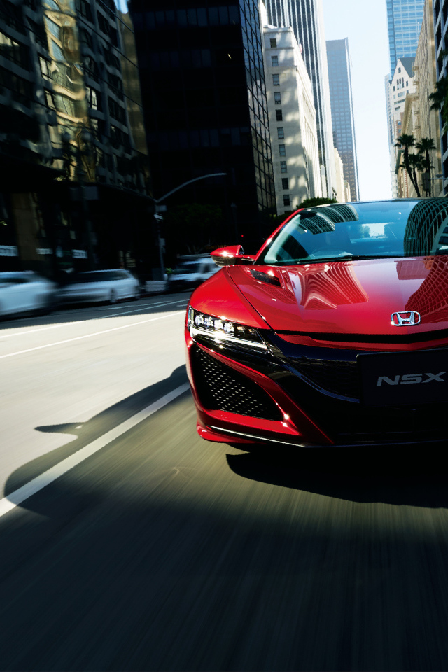 Стильный бордовый автомобиль Honda NSX 2018 года на трассе
