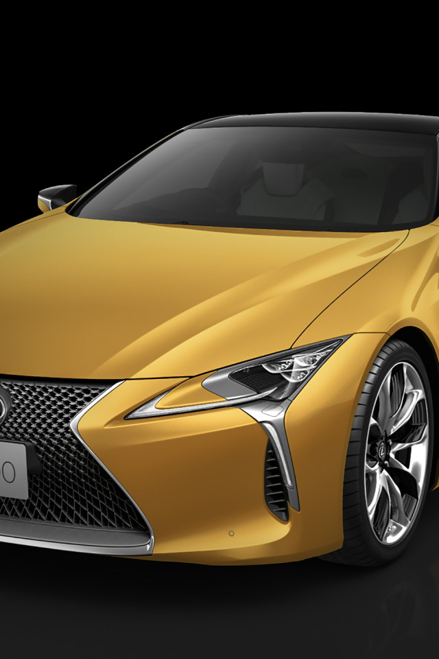 Оранжевый Lexus LC 500 2018 года на черном фоне