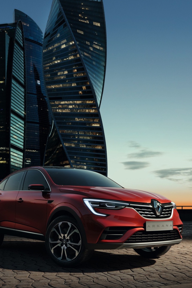 Cross-country Renault Arkana, 2019 against the backdrop of a megacity