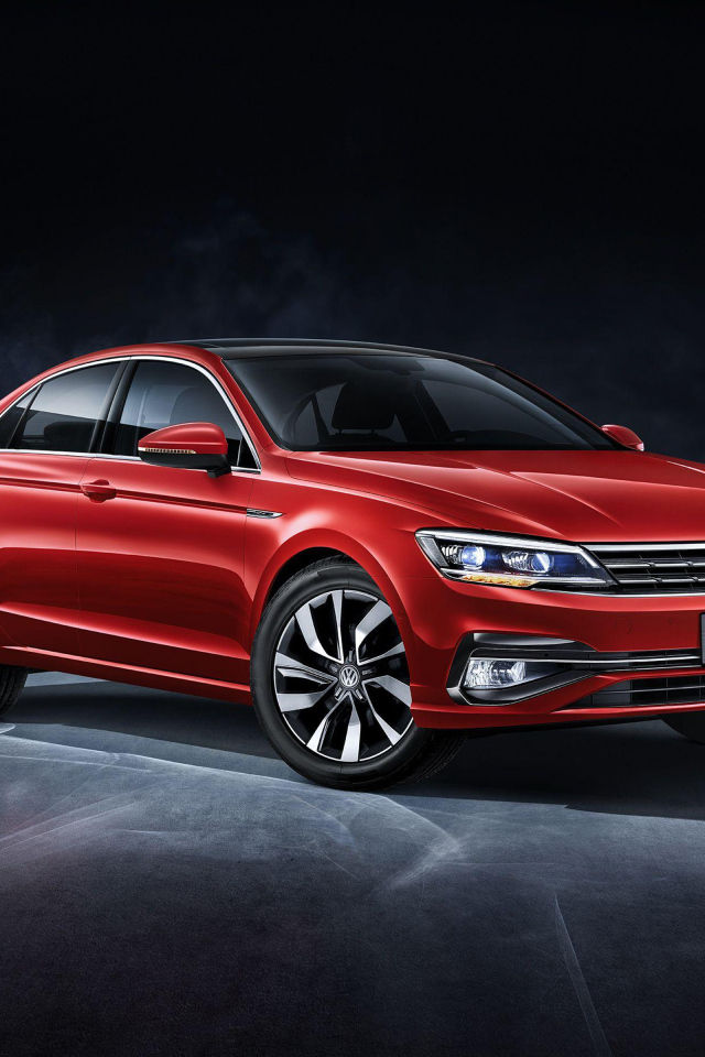 Красный автомобиль Volkswagen Lamando, 2018 на сером фоне