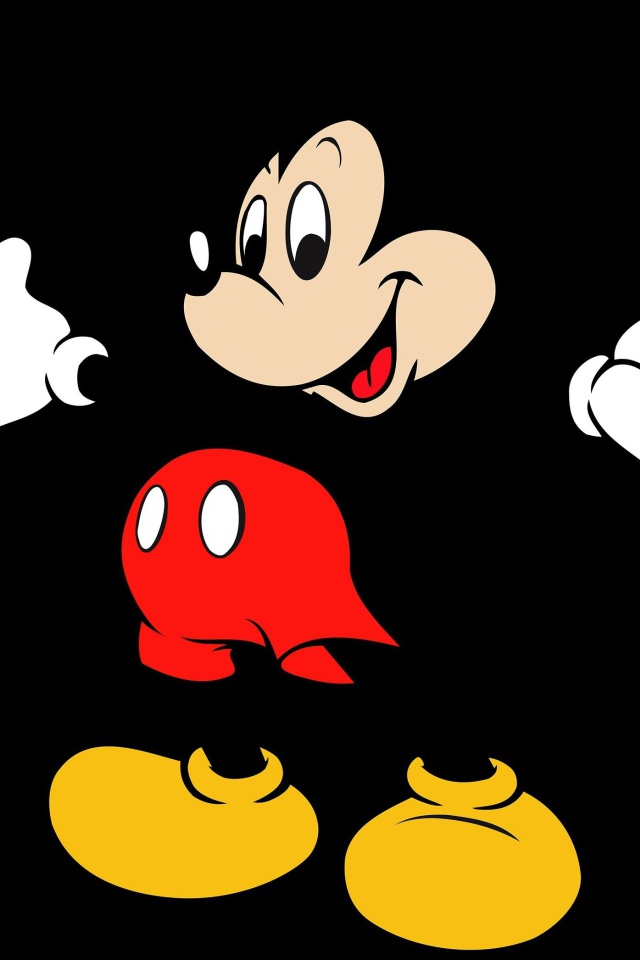 Популярный герой мультфильмов Микки Маус на черном фоне