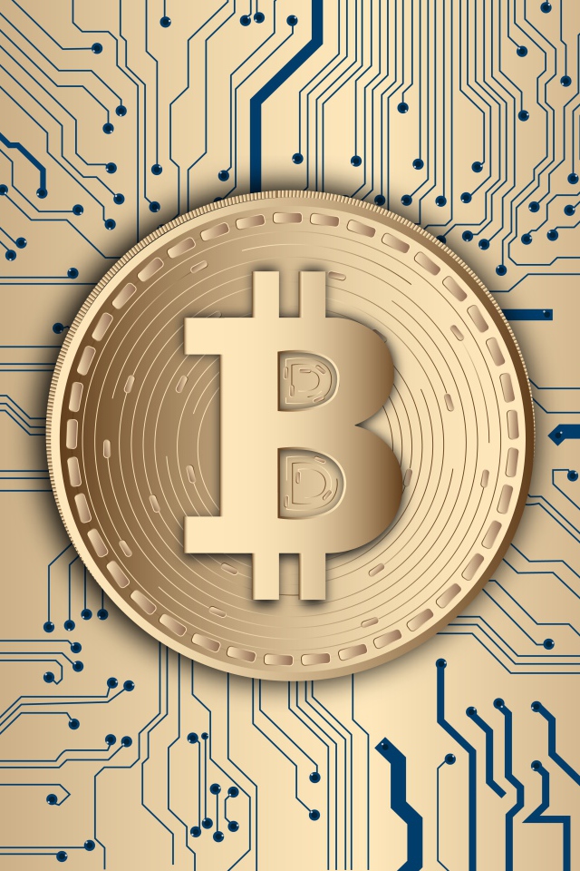 Монета биткоин на электронной плате