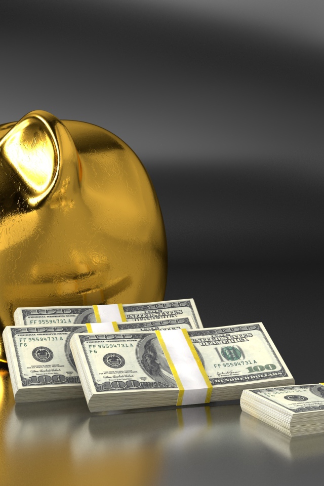 Свинья копилка на сером фоне с пачками долларов