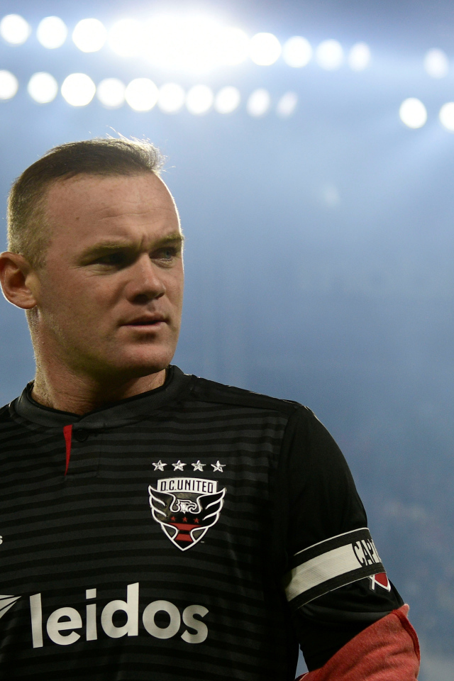 English footballer Wayne Rooney on the football field