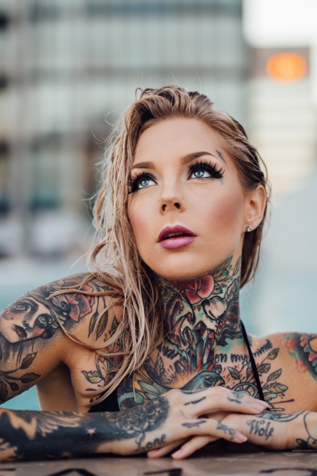 Young girl with beautiful tattoos on her body