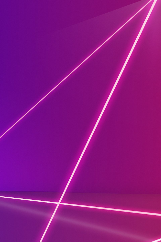 Розовые лазерные лучи на сиреневом фоне